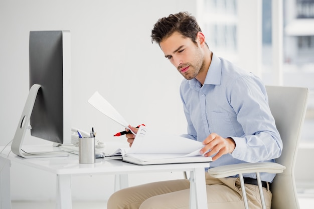 Businessman taking notes at his desk