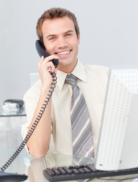 Businessman talking on phone in the office