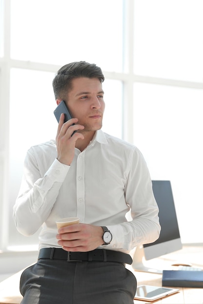 Businessman talking on the phone during a work break