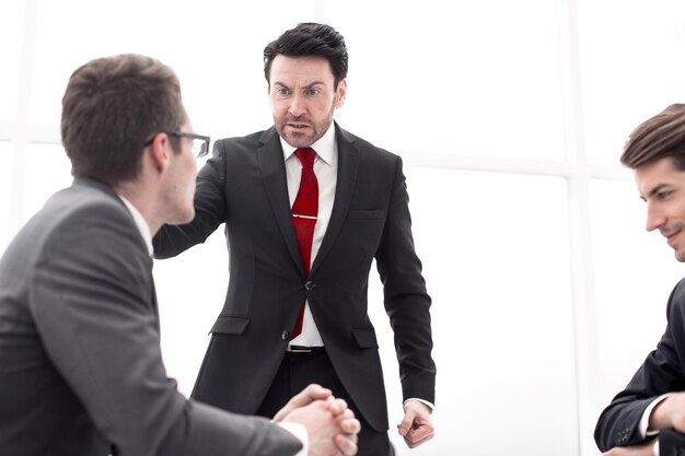 Businessman talking with employees at a working meeting business problem