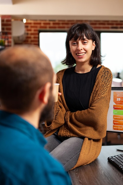 Businessman talking with manager woman discussing marketing strategy working at company presentation brainstorming ideas in startup office. Businesspeople planning business meeting