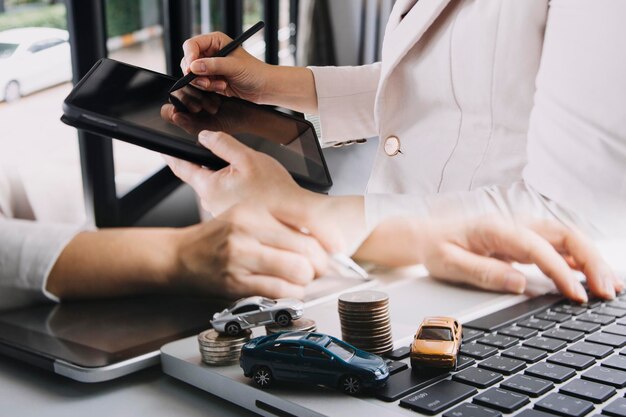 Businessman and team analyzing financial statement Finance task with smart phone and laptop and tablet Wealth management concept