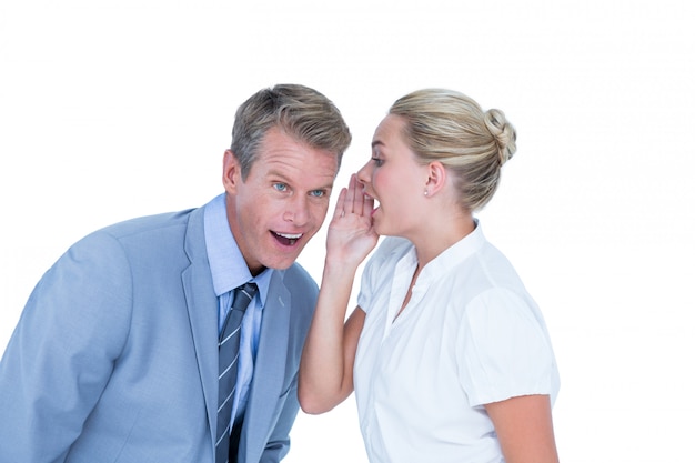  Businessman telling secret to a businesswoman