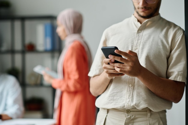 Businessman texting in mobile phone