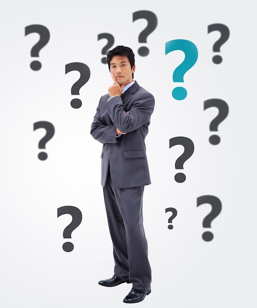 businessman thinking on question mark background