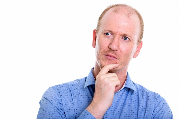 Photo businessman thinking while looking up isolated on white