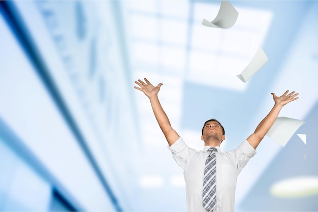 Businessman throwing papers