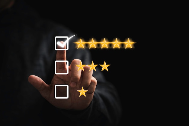 Businessman touching button to select five stars for the best excellent evaluation of customer satisfaction of product and service concept.