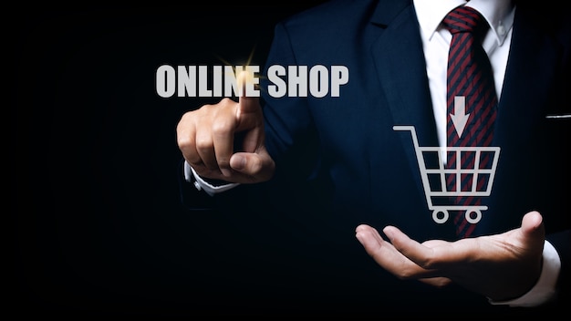 Businessman touching online shop button. e-commerce business online concept. shopping online concept.