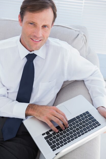 Businessman typing on his laptop