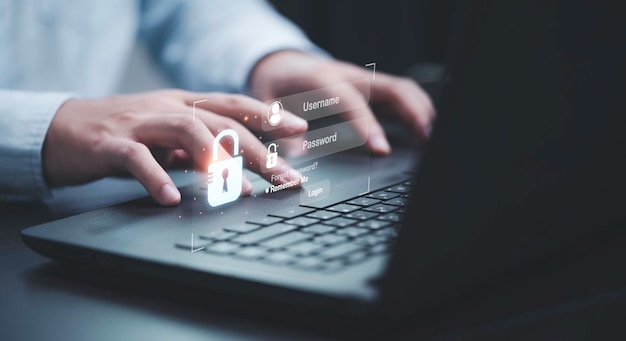 Бизнесмен печатает на клавиатуре ноутбука, чтобы ввести имя пользователя и пароль для системы безопасности или технологии и предотвратить хакерскую концепцию