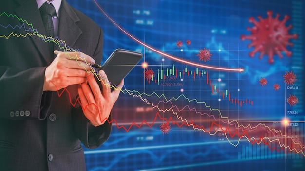 businessman use mobile phone to analysis stock market graph due coronavirus or covid19 crisis