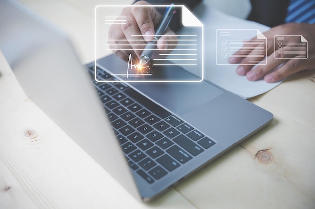 Photo businessman use a pen to sign electronic documents digital on a virtual screen technology document management and paperless office concept