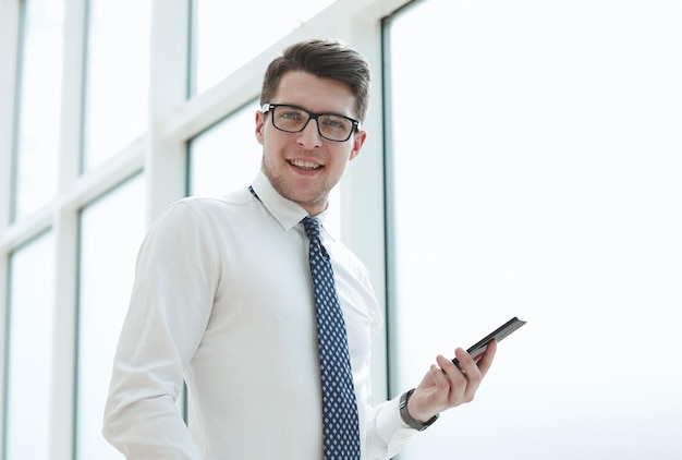 Businessman use phone and smile in the office