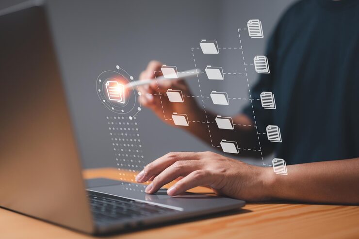 Photo a businessman uses a computer to learn about document management concepts online documentation databases digital file storage systems database technology file access and document sharing