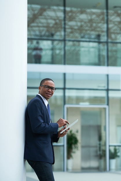 Businessman Using App on Tablet