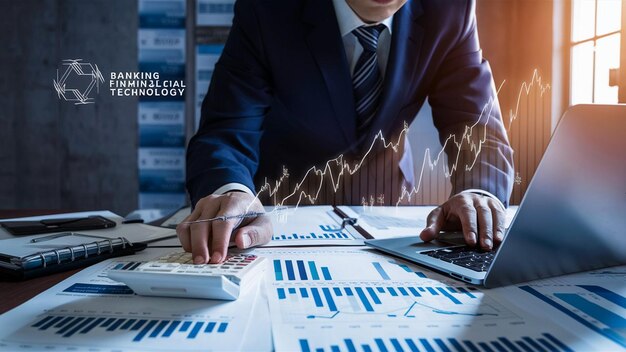 businessman using a calculator to calculating and analyzing data investment consultant