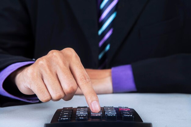 Businessman using a calculator