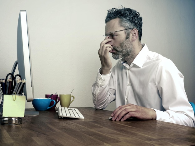 businessman using computer at desk in office