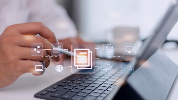 Photo businessman using a computer to document management concept online documentation database and digital file storage system software records keeping database technology file access doc sharing