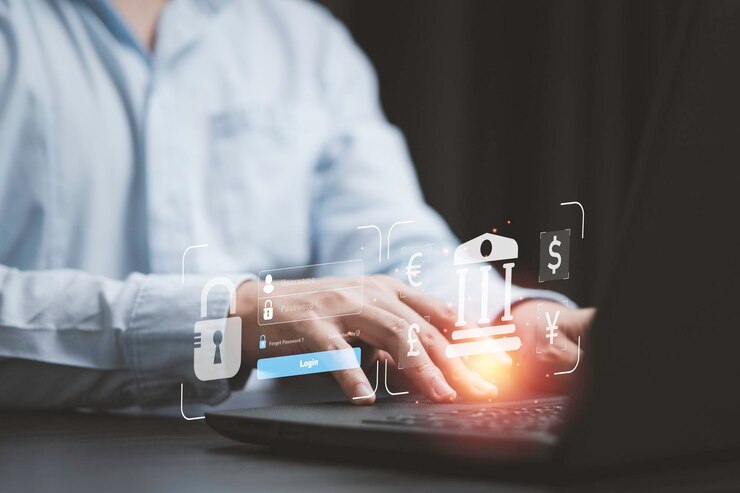 Businessman using computer laptop to input username and password for trading forex or currency exchange concept