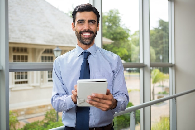 Businessman using digital tablet at conference centre