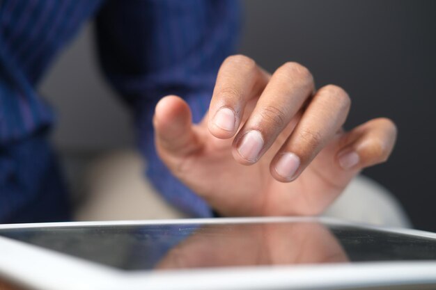 businessman using digital tablet on office desk