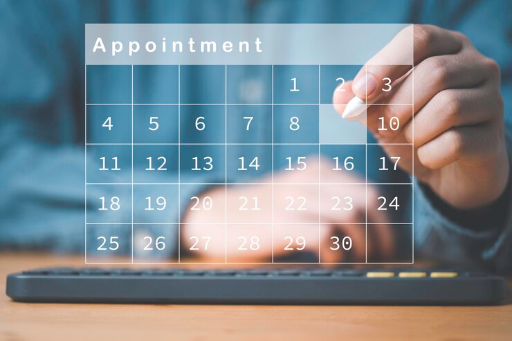 Businessman using electronic pen to reserve business schedule plan on virtual screen calendar Project management concept