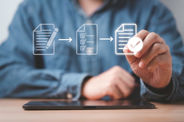 businessman using electronic pen sign tick mark on virtual document for online approve paperless quality assurance and erp management prepare check and approve concept