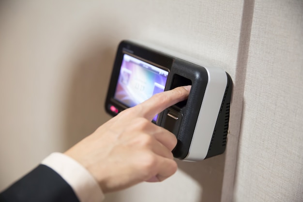 Businessman Using Finger Print To Open Door.