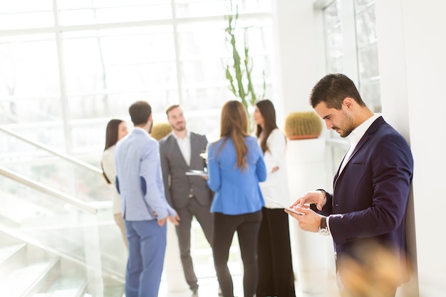 Businessman using his digital tablet at the office