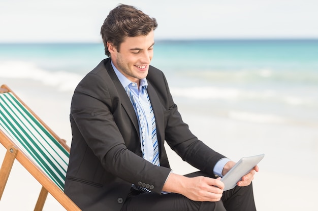 Businessman using his tablet pc 