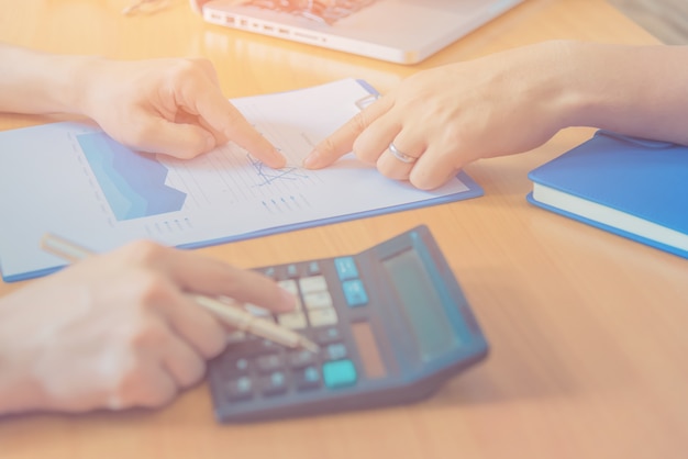 Businessman using a laptop to analysis marketing.