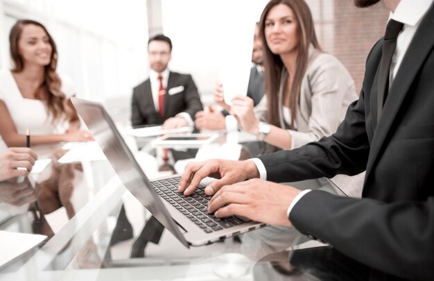 Businessman using laptop during a meeting of the Board of Directorspeople and technology