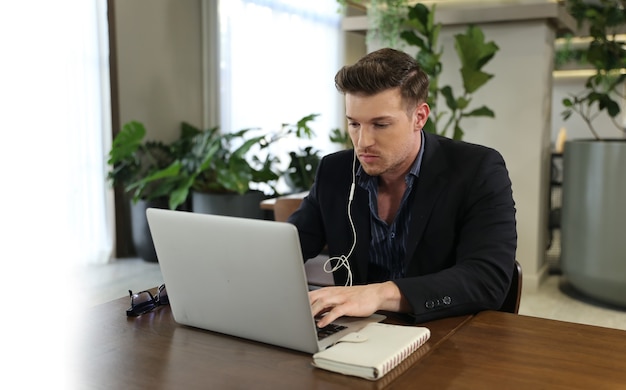 businessman using laptop in modern office