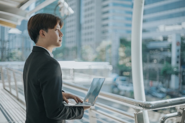 businessman using laptop outdoor