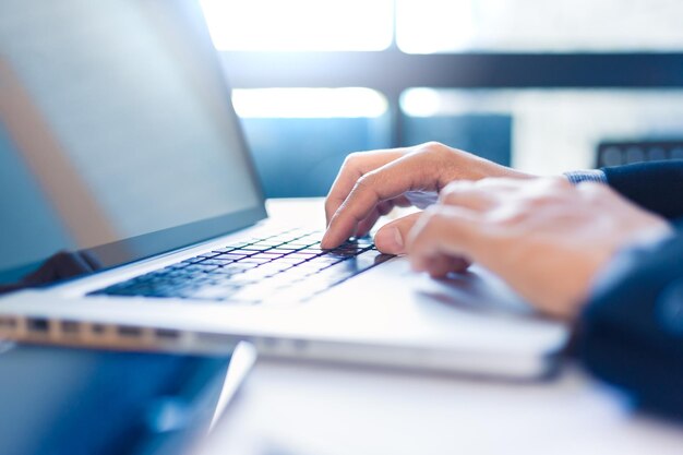 Businessman using laptop on table