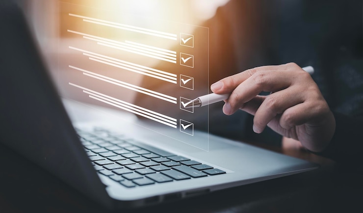 Photo businessman using a laptop and taking an assessment questionnaire evaluation online survey online exam choosing the right answer in exam by filling out the online survey formanswer test questions