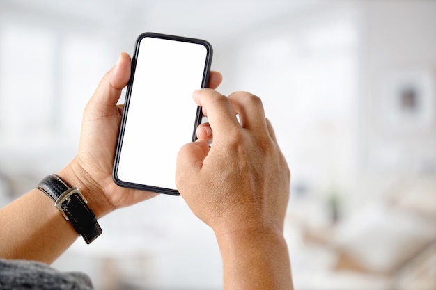 Businessman using a mobile phone. Blank screen smart phone for graphic display montage.