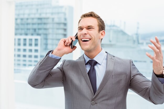 Businessman using mobile phone in office