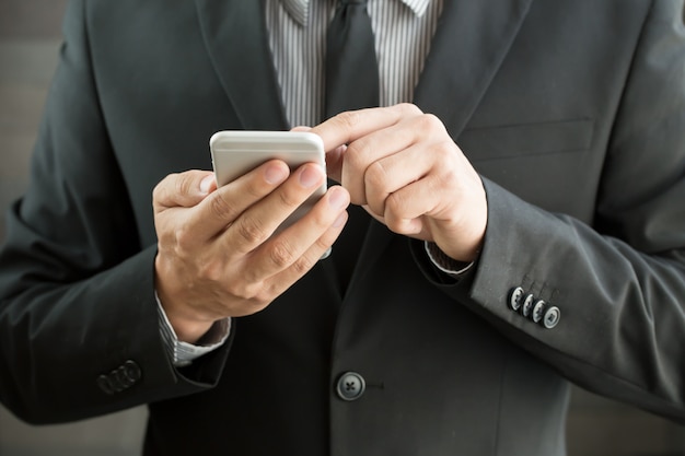 Businessman using mobile smartphone