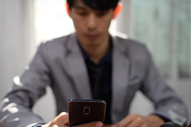 Businessman using smart phone to work, communicate.