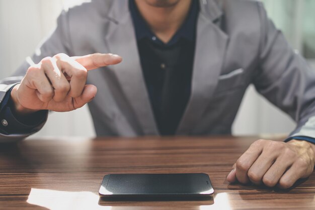 Businessman using smart phone to work, communicate.