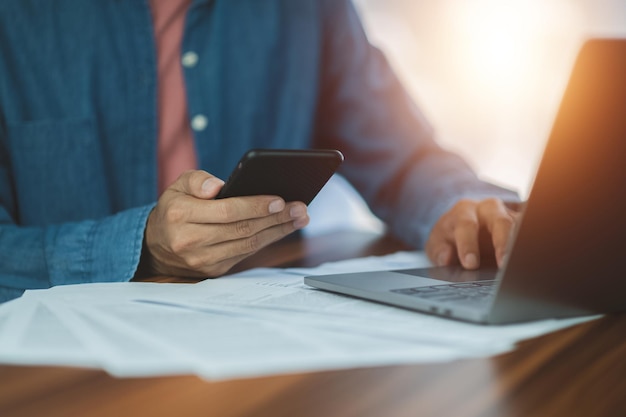 Businessman using smartphone in office