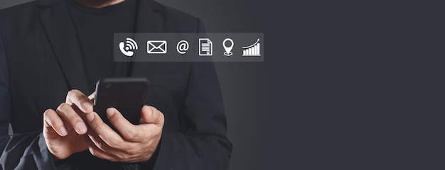 Photo businessman using smartphone with contact and work icons. application online technology information connection on mobile phone.