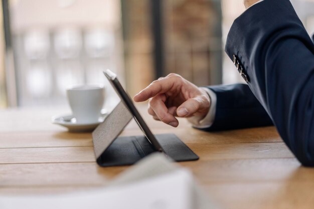 Businessman using tablet on table