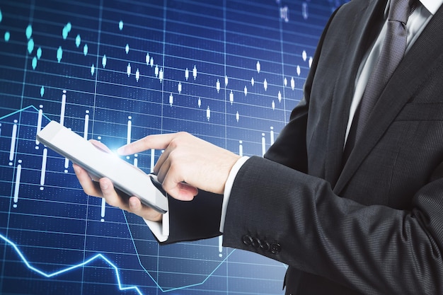 businessman using tablet with business report hologram