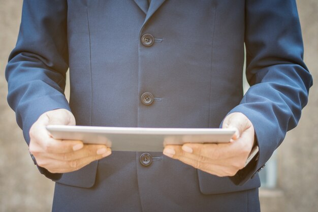 Businessman using a tablet.