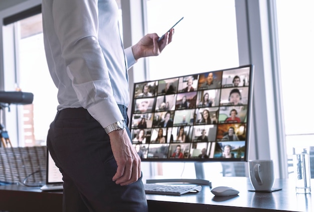 businessman using video chat on computer and phone