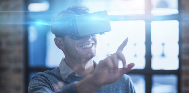 Businessman using virtual reality headset in office